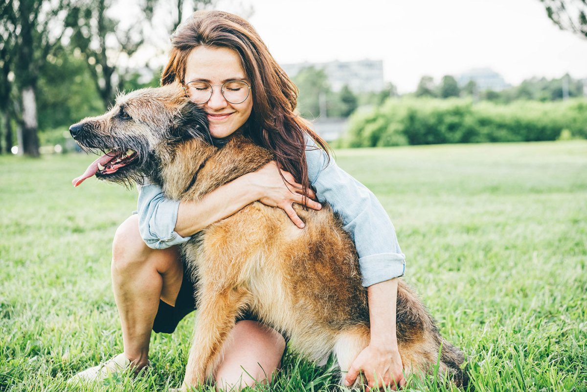 smiling woman with senior dog