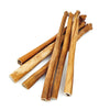 Seven Best Bully Collagen Sticks, a natural alternative to rawhide by Best Bully Sticks, are elegantly arranged on a white background.